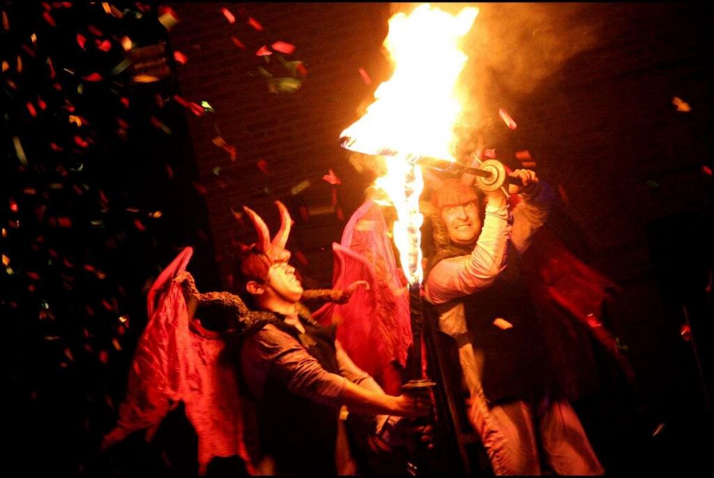 Devils fighting with flaming swords from the Company of Fools, Inferno