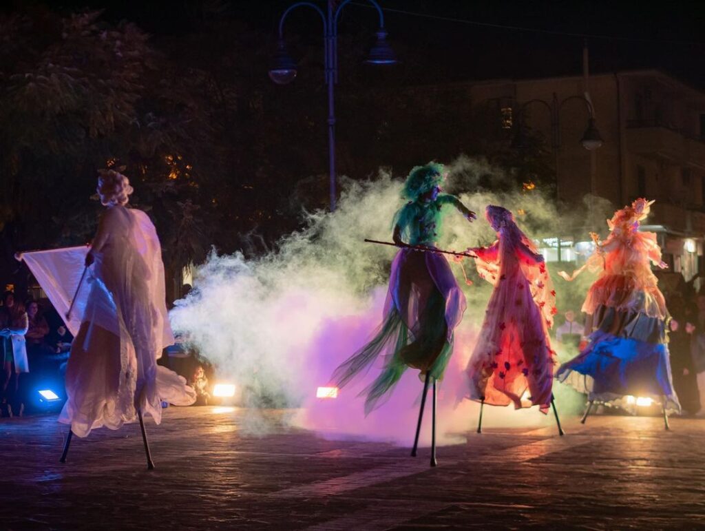 Trampolinists dressed as four seasons dancing