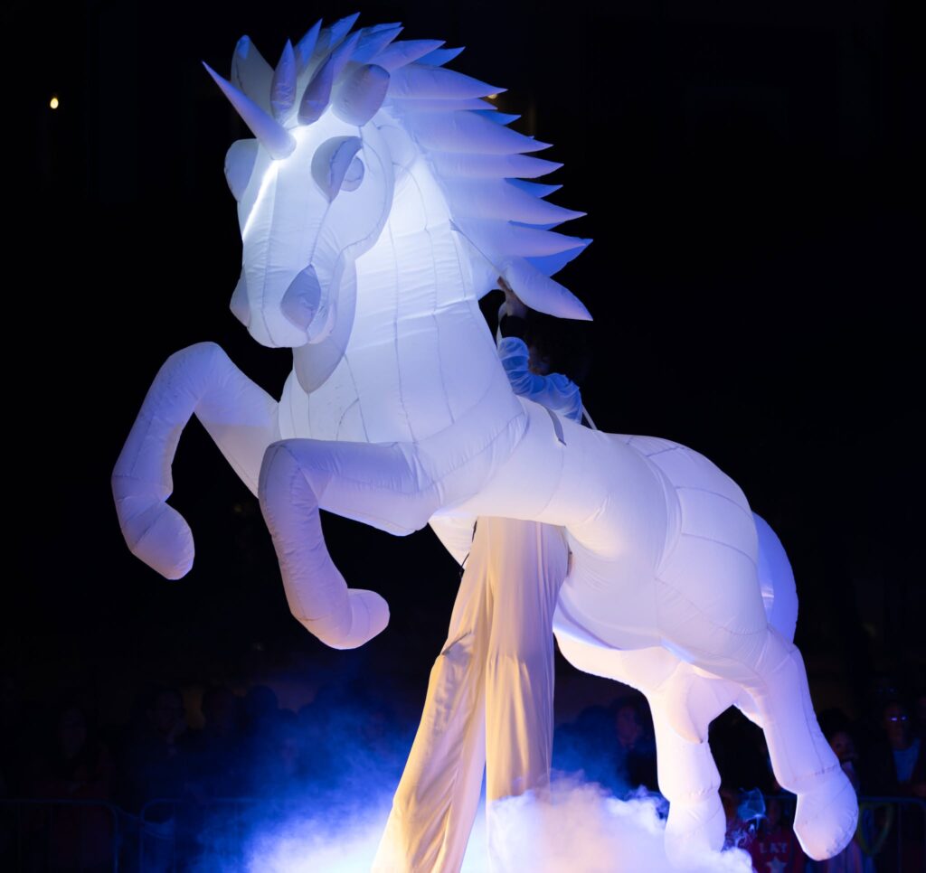 Luminous parade unicorn of the Compagnia dei Folli procession of light