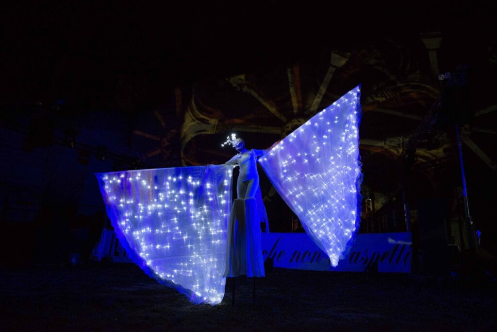 luminous butterfly on stilts with open wings