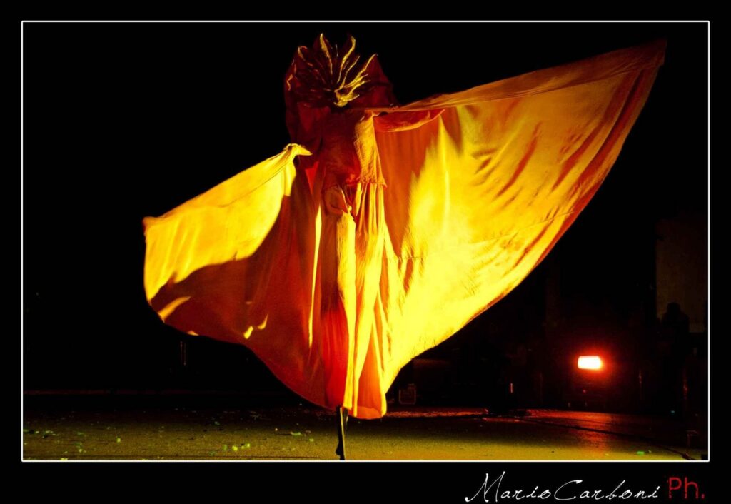 Sun-costumed trampolinist from the Compagnia dei Folli