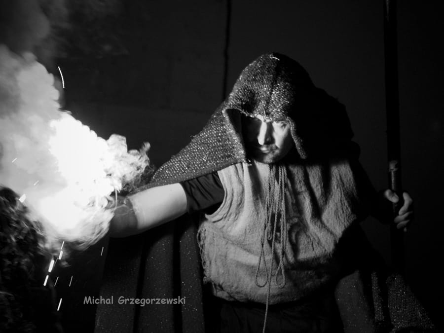 The hunchback with a smoke grenade in his hand
