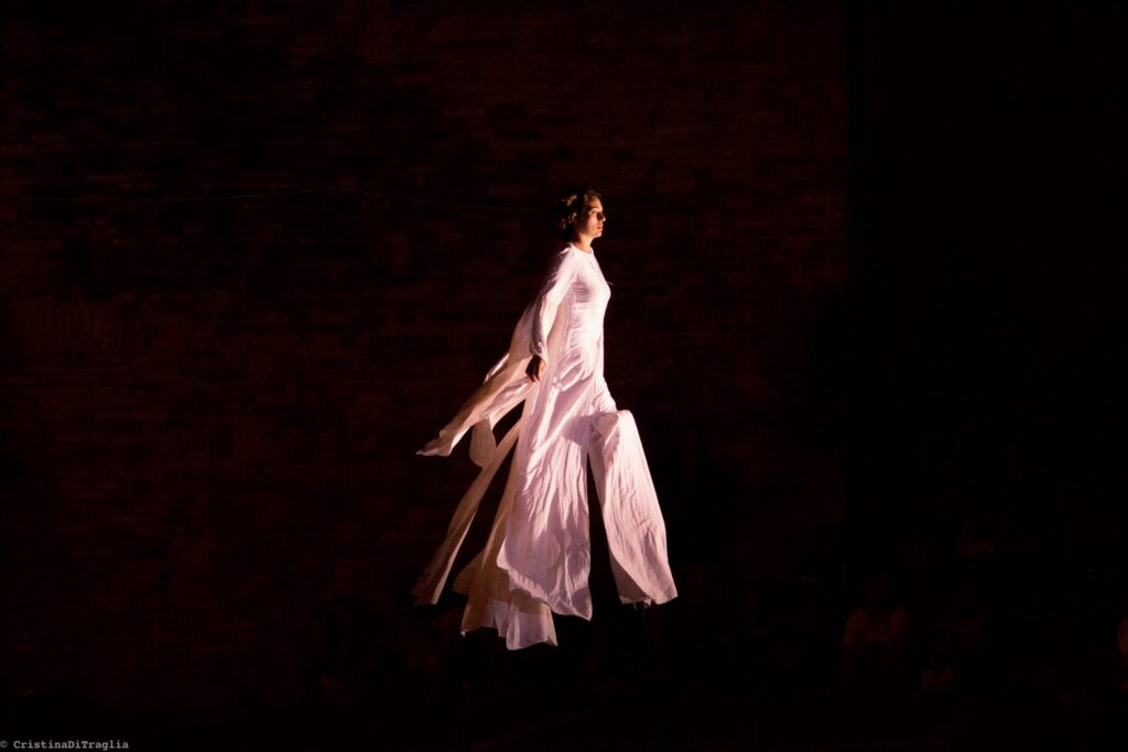 White-clad trampolinist from the Compagnia dei Folli